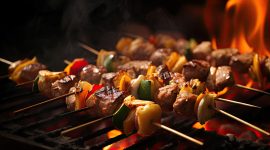Barbecue skewers meat kebabs with vegetables on flaming grill